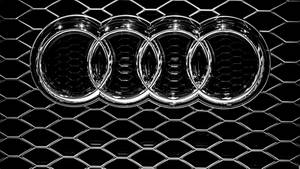 Silver Audi Car Emblem In Solid Black Wallpaper