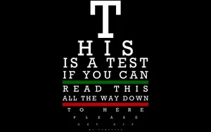 Simple Eye Test On Black Background Wallpaper