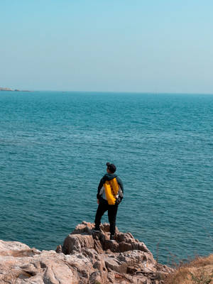 Single Boy In Blue Ocean Wallpaper