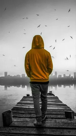 Single Boy In Yellow Hoodie Wallpaper