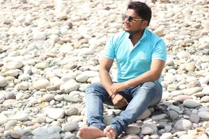 Single Boy On Rocks Wallpaper