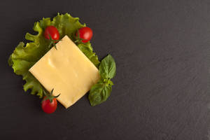 Single Cheese Slice On Leaf Wallpaper