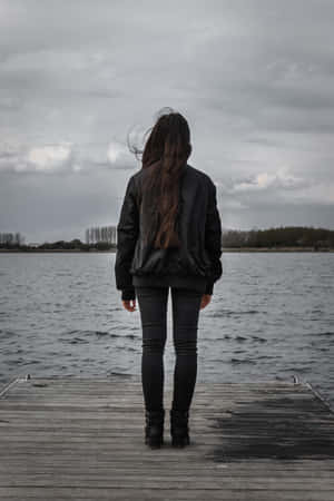 Single Woman In Black By The Lake Wallpaper