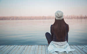 Single Woman On A Dock Wallpaper