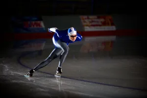 Skater Grinding A Rail On His Skateboard Wallpaper