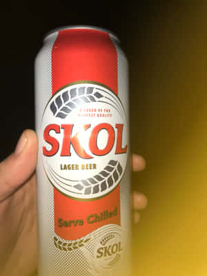 Skol Lager Beer Can Held Wallpaper