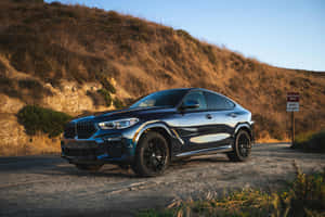 Sleek_ Black_ Coupe_ S U V_ Dusk_ Lighting Wallpaper