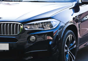 Sleek Black Luxury Car Closeup Wallpaper
