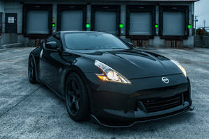 Sleek Black Nissan 370z Sports Car Wallpaper