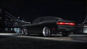Sleek Dodge Challenger In Pitch Black Wallpaper