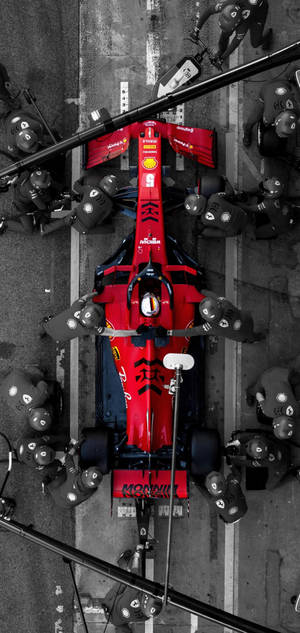 Sleek F1 Phone With Red Ferrari Theme - Top View Wallpaper