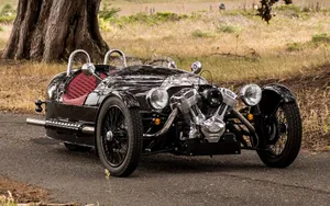 Sleek Morgan Sports Car On A Picturesque Road Wallpaper