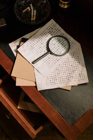 Sleuth With Magnifying Glass Wallpaper