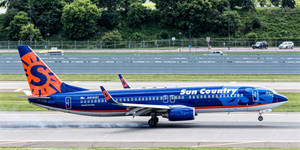Slick Aviation Takeoff Of Sun Country Aircraft Wallpaper