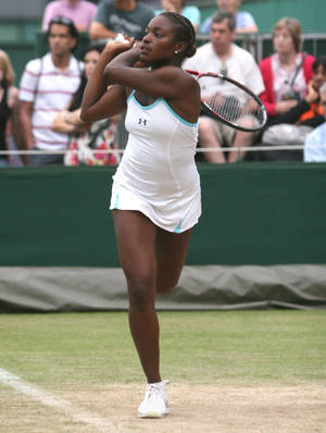 Sloane Stephens In Action With Her Racket Wallpaper