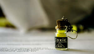 Small Bottle With Toxic Label Wallpaper
