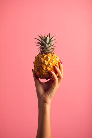 Small Pineapple On Pink Background Wallpaper