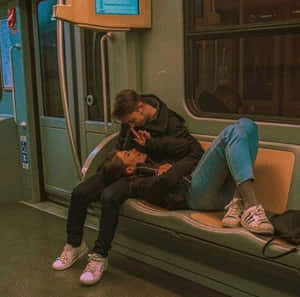 Smiling Couple Enjoying A Sweet Moment Together Wallpaper