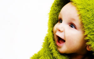 Smiling Cute Child In Green Wallpaper