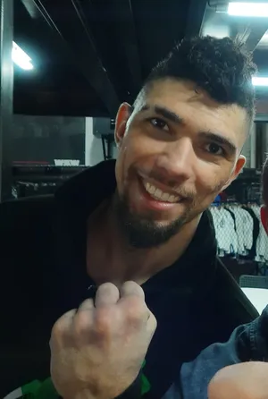 Smiling Johnny Walker Showing Clenched Fist Wallpaper