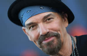 Smiling Manin Blue Bandanaand Black Hat Wallpaper