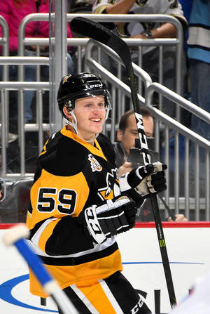 Smiling Nhl Player Jake Guentzel Wallpaper