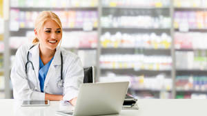 Smiling Pharmacist Laptop Wallpaper
