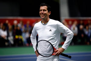 Smiling Portrait Of Tennis Legend Tim Henman Wallpaper