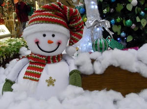 Smiling Snowman Toy Wallpaper
