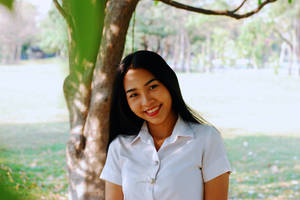 Smiling Thailand Woman In White Uniform Wallpaper