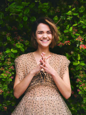 Smiling Womanin Garden Dress Wallpaper
