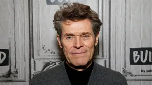 Smirking Willem Dafoe Wallpaper