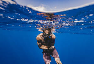 Snorkeling Waterline Shot Wallpaper