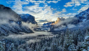 Snow Capped Mountains And Pristine Lake Offer Breathtaking Views Of Winter Wallpaper