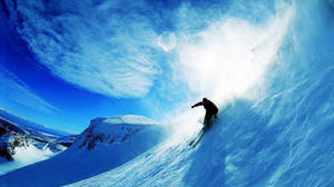 Snowboard Creating Wave Of Snow Wallpaper