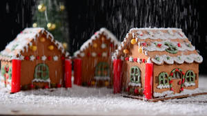 Snowing Gingerbread House Theme Wallpaper