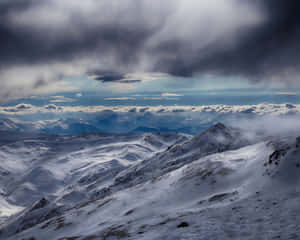 Snowy Tundra With Clouds Wallpaper