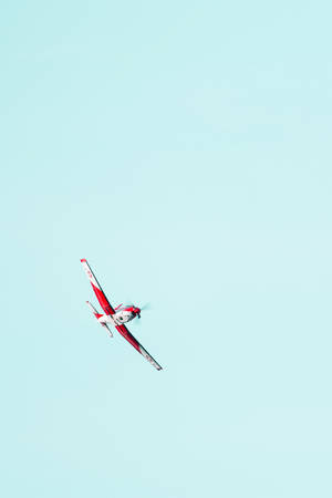 Soaring Red Airplane Iphone Wallpaper