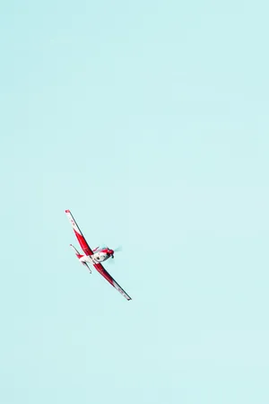 Soaring Red Airplane Iphone Wallpaper