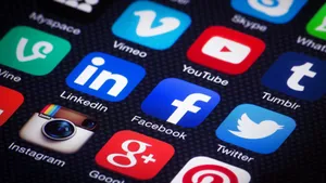 Social Media Apps On Phone Screen Wallpaper