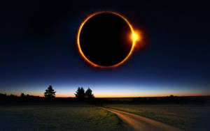 Solar Eclipse Over Country Road Wallpaper
