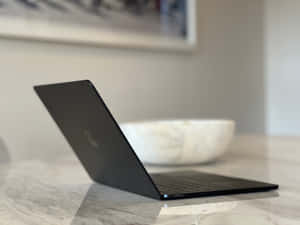 Sophisticated And Stylish Black Macbook Wallpaper