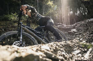 Specialized Mountain Bike In Muddy Road Wallpaper