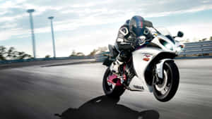 Speeding Sportbikeon Track.jpg Wallpaper