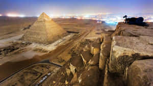 Sphinx Of Giza Illuminated At Night Wallpaper