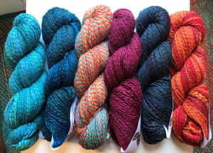 Spincycle Knitting Yarns Wallpaper