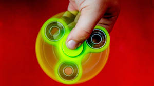 Spinning Neon Fidget Toy Wallpaper