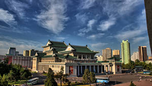 Splendid View Of Pyongyang Grand Theatre Under The Blue Sky Wallpaper