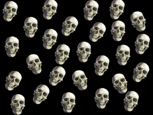 Spooky Halloween Skeleton Grinning In The Darkness Wallpaper