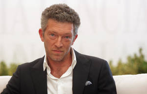 Staring Vincent Cassel Black Suit Wallpaper